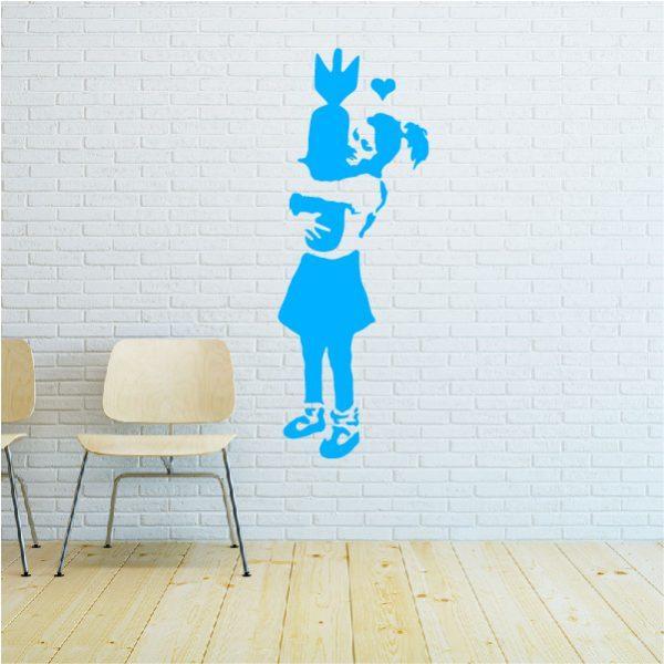 Girl with Bomb. Banksy's graffiti. Wall sticker. Blue
