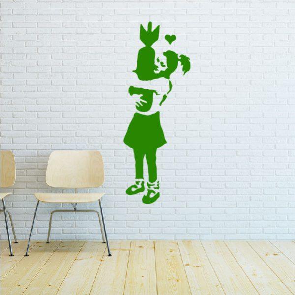 Girl with Bomb. Banksy's graffiti. Wall sticker. Green