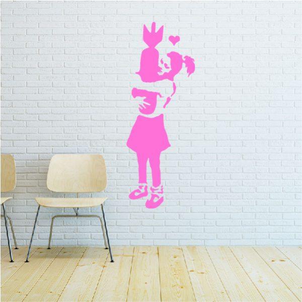 Girl with Bomb. Banksy's graffiti. Wall sticker. Pink
