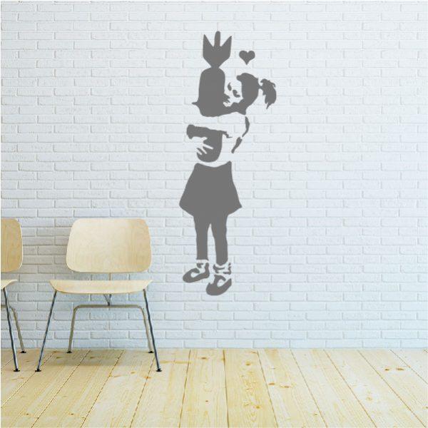 Girl with Bomb. Banksy's graffiti. Wall sticker. Silver