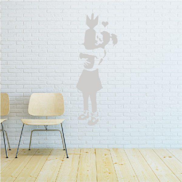 Girl with Bomb. Banksy's graffiti. Wall sticker. White